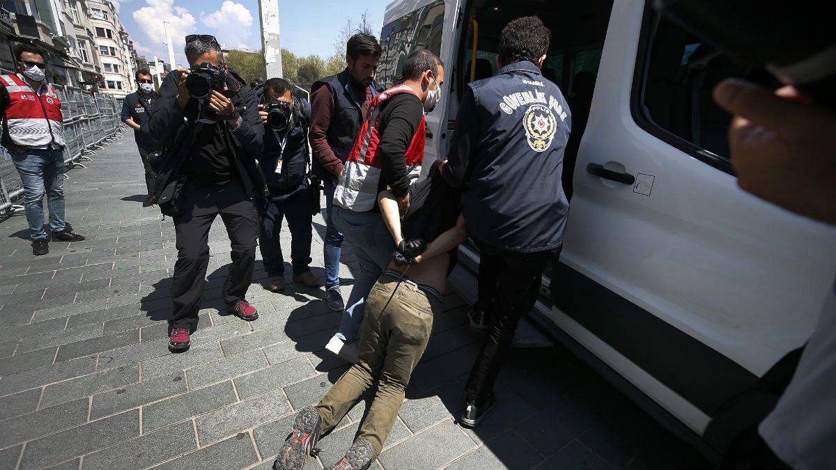 Turkish police officers arrest protesters