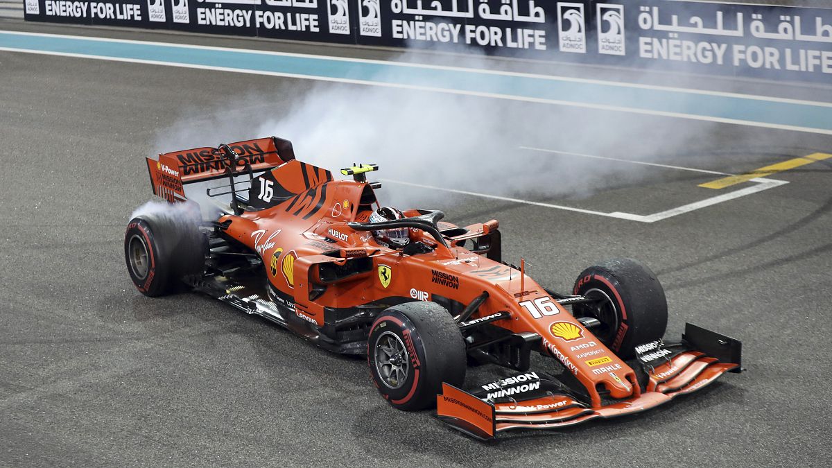 Ferrari driver Charles Leclerc of Monaco celebrates at finish line after he placed third in the Emirates Formula One Grand Prix, Sunday, Dec.1, 2019.