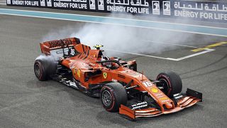 Ferrari driver Charles Leclerc of Monaco celebrates at finish line after he placed third in the Emirates Formula One Grand Prix, Sunday, Dec.1, 2019.