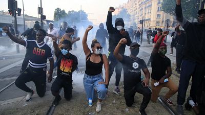 Protesters react during a demonstration Tuesday, June 2, 2020 in Paris.