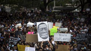 Thousands of members of the community gathered to mourn the death of George Floyd during a march across downtown Houston, Texas on Tuesday, June 2, 2020.