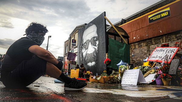 Trevor Rodriquez sits alone at the spot where Floyd died while in police custody, Tuesday June 2, 2020, in Minneapolis. Trevor Rodriquez sits alone at the spot where Floyd died while in police custody, Tuesday June 2, 2020, in Minneapolis.