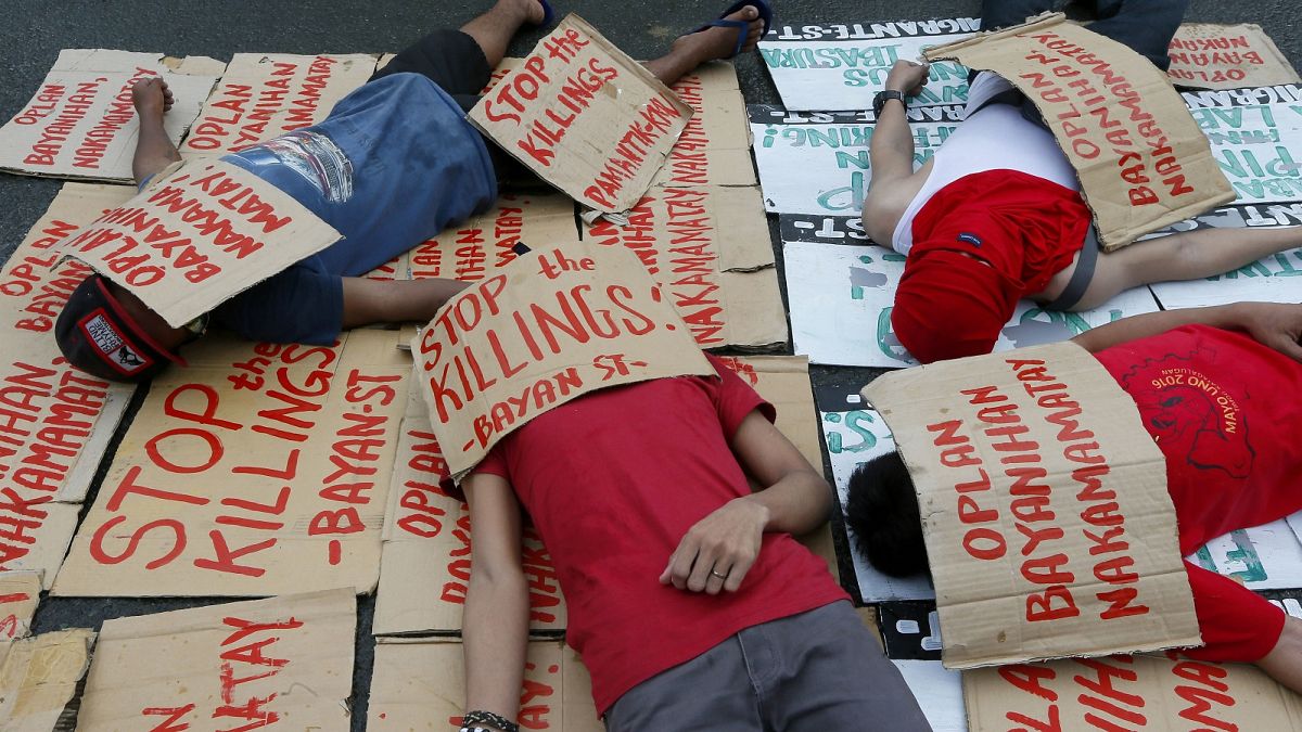 Students stage a die-in to protest the rise in extra-judicial killings in the Philippines "drugs war"