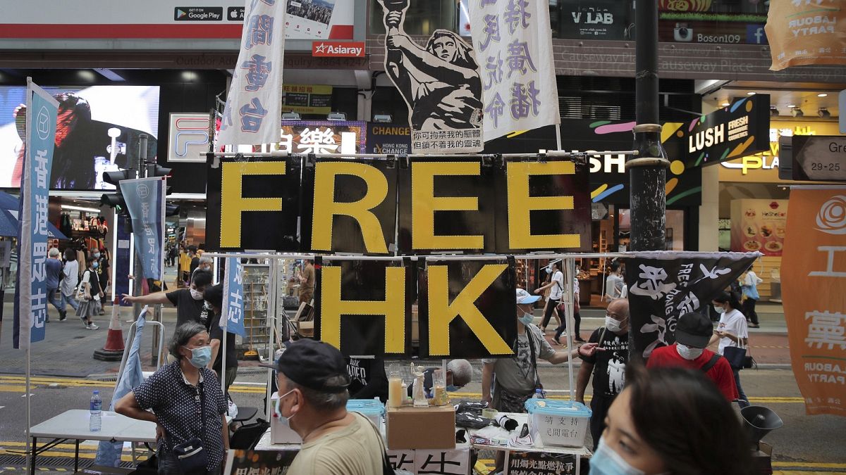 A booth with a "Free Hong Kong" sign is set up near Victoria Park where people gather to mourn those killed in the 1989 Tiananmen crackdown