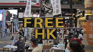 A booth with a "Free Hong Kong" sign is set up near Victoria Park where people gather to mourn those killed in the 1989 Tiananmen crackdown