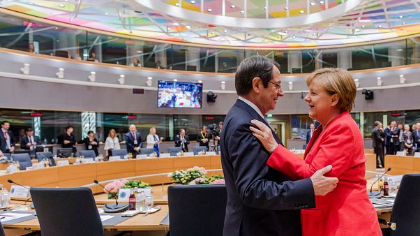 German Chancellor Angela Merkel, right, speaks with Cypriot President Nicos Anastasiades German Chancellor Angela Merkel, right, speaks with Cypriot President Nicos Anastasiades