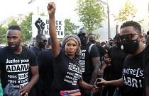 Assa Traore, sister of Adama Traore, raises her fist during a demonstration in Paris.