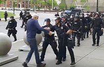 A Buffalo police officer shoves a man who walked up to police Thursday, June 4, 2020, in Buffalo, N.Y.