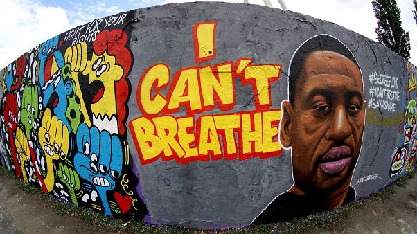 A graffiti by artist 'EME Freethinker' that expresses support of U.S. protests over the death of George Floyd in the public park 'Mauerpark' in Berlin, Germany A graffiti by artist 'EME Freethinker' that expresses support of U.S. protests over the death of George Floyd in the public park 'Mauerpark' in Berlin, Germany