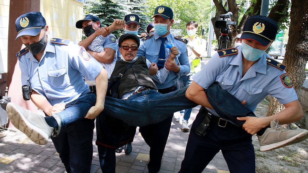Kazakh police detain a demonstrator during a demonstration called by political opposition groups, Almaty, Kazakhstan, June 6, 2020. 
