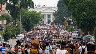 Demonstrators protest Saturday, June 6, 2020, near the White House in Washington, over the death of George Floyd