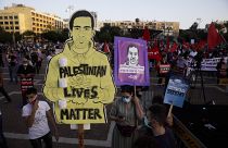 Protesters attenda rally against Israel plans to annex parts of the West Bank, in Tel Aviv, Israel, Saturday, June 6, 2020.