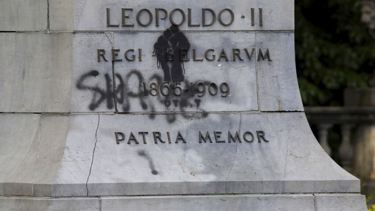 A statue of Belgium's King Leopold II is defaced with the words 'shame' prior to a Black Lives Matter protest rally in Brussels, Sunday, June 7, 2020. 
