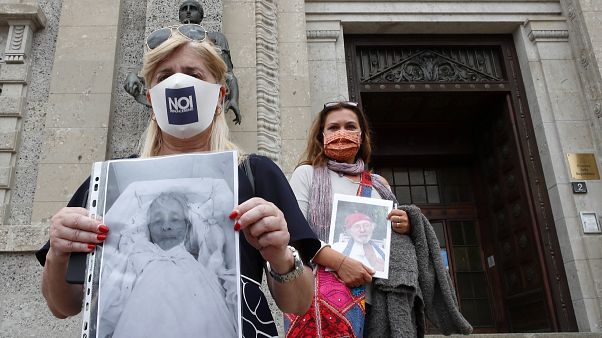 Members of an association of relatives of coronavirus victims filed a complaint with prosecutors seeking responsibility for the deaths of their loved ones. Members of an association of relatives of coronavirus victims filed a complaint with prosecutors seeking responsibility for the deaths of their loved ones.