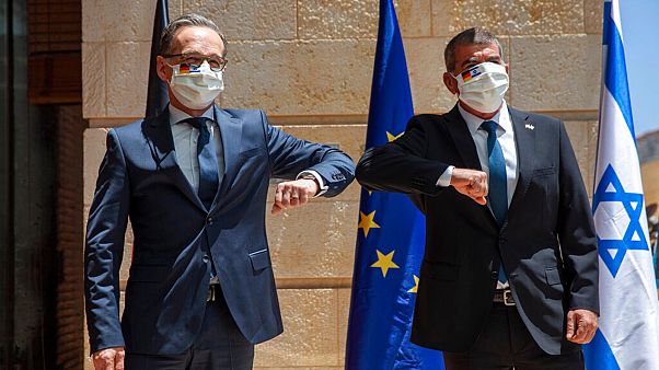 Israeli Foreign Minister Gabi Ashkenazi, right, welcomes his German counterpart Heiko Maas with an elbow bump prior to their meeting in Jerusalem, Wednesday, June 10, 2020 Israeli Foreign Minister Gabi Ashkenazi, right, welcomes his German counterpart Heiko Maas with an elbow bump prior to their meeting in Jerusalem, Wednesday, June 10, 2020