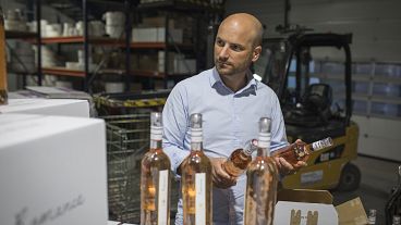 Sebastien Latz, director of French wine producer MDCV, inspects bottles of rosé at Chateau des Bertrands vineyard in Le Cannet-des-Maures, in the Provence region, Oct 2019