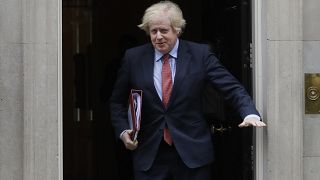 Britain's Prime Minister Boris Johnson leaves 10 Downing Street to attend the weekly session of PMQs in Parliament in London, Wednesday, June 10, 2020.
