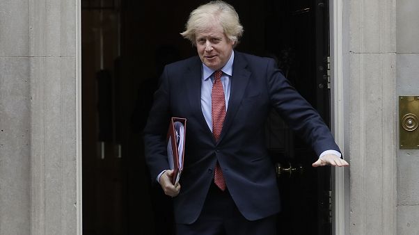 Britain's Prime Minister Boris Johnson leaves 10 Downing Street to attend the weekly session of PMQs in Parliament in London, Wednesday, June 10, 2020.