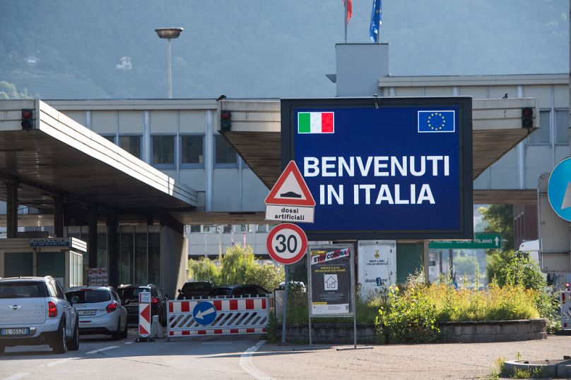 Cars cross the Swiss-Italian border.