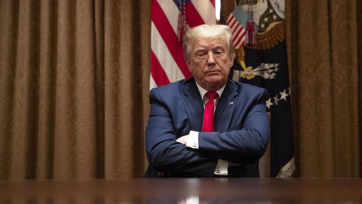 President Donald Trump listens during a roundtable discussion with African-American supporters in the Cabinet Room of the White House, Wednesday, June 10, 2020, in Washington.