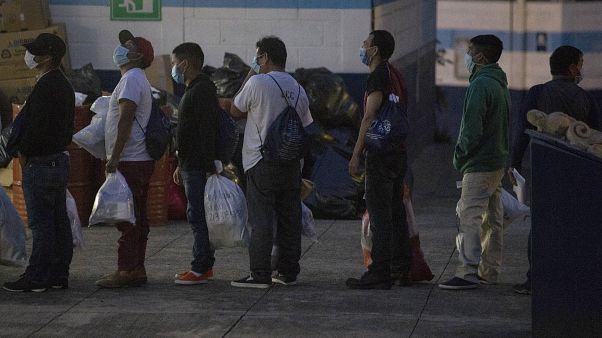 Guatemalans deported from the U.S., wearing a mask as a precaution against the spread of the new coronavirus Guatemalans deported from the U.S., wearing a mask as a precaution against the spread of the new coronavirus