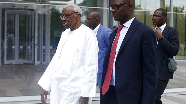 Former president of the IAAF (International Association of Athletics Federations) Lamine Diack, left, arrives at the Paris courthouse, Wednesday, June 10, 2020 Former president of the IAAF (International Association of Athletics Federations) Lamine Diack, left, arrives at the Paris courthouse, Wednesday, June 10, 2020