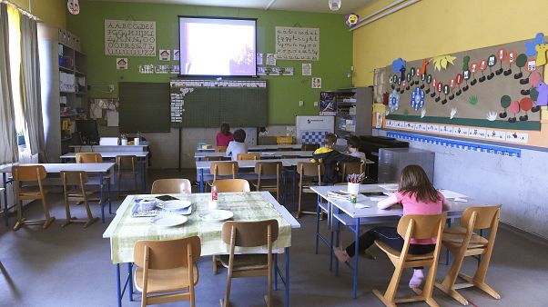 FILE: Primary school pupils watch their teacher speak on the display in a school in Budapest, 31 March, 2020. FILE: Primary school pupils watch their teacher speak on the display in a school in Budapest, 31 March, 2020.