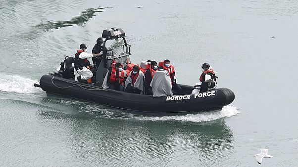 A group of people, thought to be migrants are transported on a Border Force vessel, in Dover, England, Monday, April 27, 2020 A group of people, thought to be migrants are transported on a Border Force vessel, in Dover, England, Monday, April 27, 2020