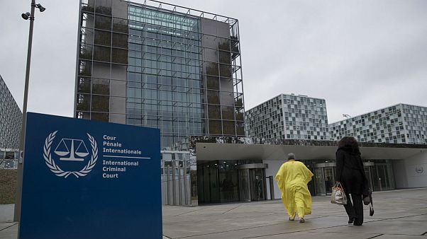 Supporters of former Ivory Coast President Laurent Gbagbo walk towards the International Criminal Court in The Hague, Netherlands, Wednesday, Jan. 16, 2019 Supporters of former Ivory Coast President Laurent Gbagbo walk towards the International Criminal Court in The Hague, Netherlands, Wednesday, Jan. 16, 2019