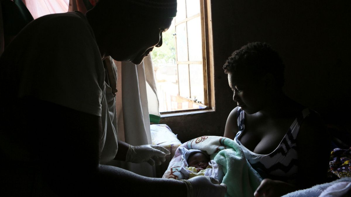 A baby is born in the poor surburb of Mbare in Harare, Zimbabwe, Saturday, Nov. 16, 2019.