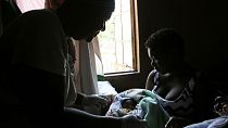 A baby is born in the poor surburb of Mbare in Harare, Zimbabwe, Saturday, Nov. 16, 2019.