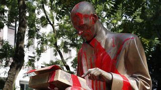 Red paint is seen on a statue of late Italian journalist Indro Montanelli, in Milan, northern Italy, Sunday, June 14, 2020 