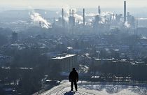 In this Jan. 19, 2016 file photo, a man watches a BP refinery in Gelsenkirchen, Germany.