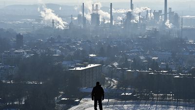 In this Jan. 19, 2016 file photo, a man watches a BP refinery in Gelsenkirchen, Germany.