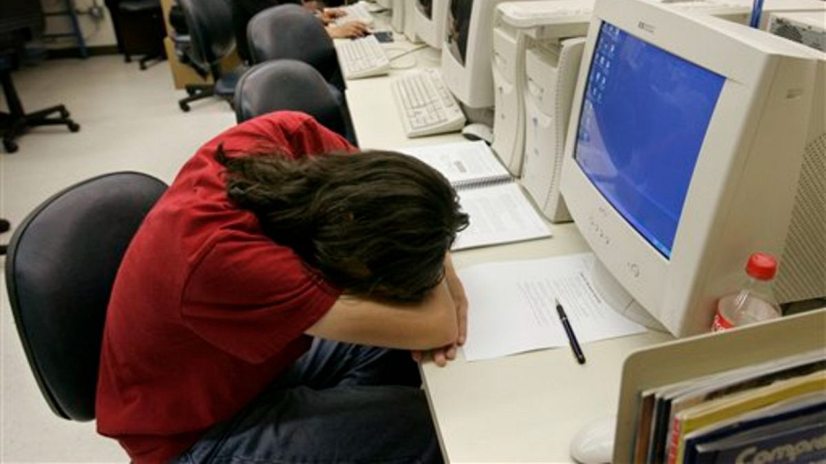 A jobseeker rests during an employment test 