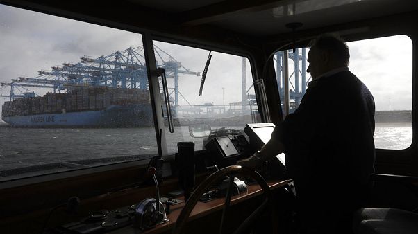 A container ship is unloaded in the harbor of Rotterdam, Netherlands, Tuesday, Sept. 11, 2018 A container ship is unloaded in the harbor of Rotterdam, Netherlands, Tuesday, Sept. 11, 2018