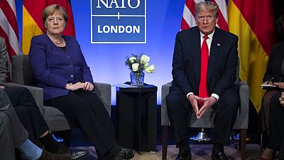 President Donald Trump meets with German Chancellor Angela Merkel during the NATO summit at The Grove, UK