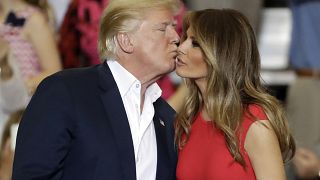 President Donald Trump kisses his wife, first lady, Melania Trump