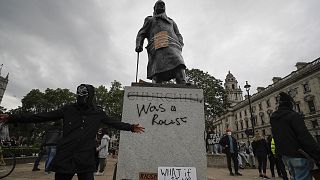 Protesters gather around Winston Churchill statue in Parliament Square during the Black Lives Matter protest rally in London.