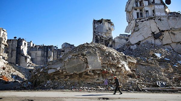 A Syrian man walks through the destruction of the Salaheddine neighborhood in eastern Aleppo, Syria - File, Jan 2018 A Syrian man walks through the destruction of the Salaheddine neighborhood in eastern Aleppo, Syria - File, Jan 2018