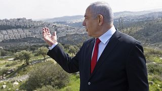 In this Feb. 20, 2020 photo, Israeli Prime Minister Benjamin Netanyahu visits the area where a new neighborhood is to be built in the East Jerusalem settlement of Har Homa.