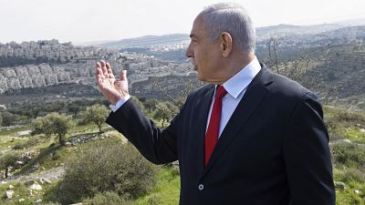 In this Feb. 20, 2020 photo, Israeli Prime Minister Benjamin Netanyahu visits the area where a new neighborhood is to be built in the East Jerusalem settlement of Har Homa.