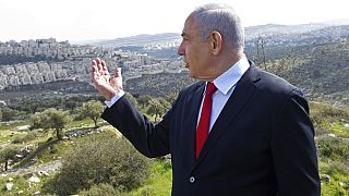 In this Feb. 20, 2020 file photo, Israeli Prime Minister Benjamin Netanyahu visits the area where a new neighborhood is to be built in the East Jerusalem settlement of Har Hom