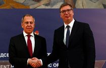 Russian Foreign Minister Sergey Lavrov, left, shakes hands with Serbia's President Aleksandar Vucic after a joint press conference in Belgrade, Serbia, Thursday, June 18, 2020