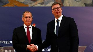 Russian Foreign Minister Sergey Lavrov, left, shakes hands with Serbia's President Aleksandar Vucic after a joint press conference in Belgrade, Serbia, Thursday, June 18, 2020