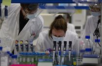 FILE: Lab technicians speak with each other during research on coronavirus, at Johnson & Johnson subsidiary Janssen Pharmaceutical in Beerse, Belgium, June 17, 2020