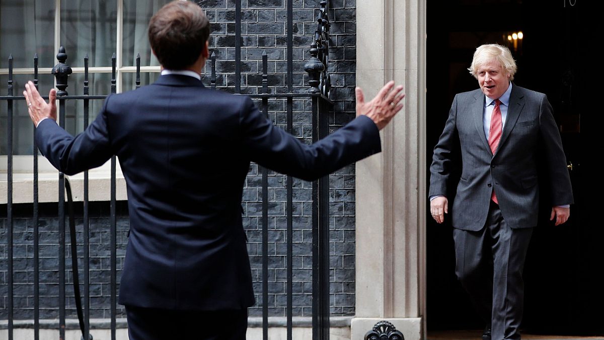 Boris Johnson greets Emmanuel Macron 
