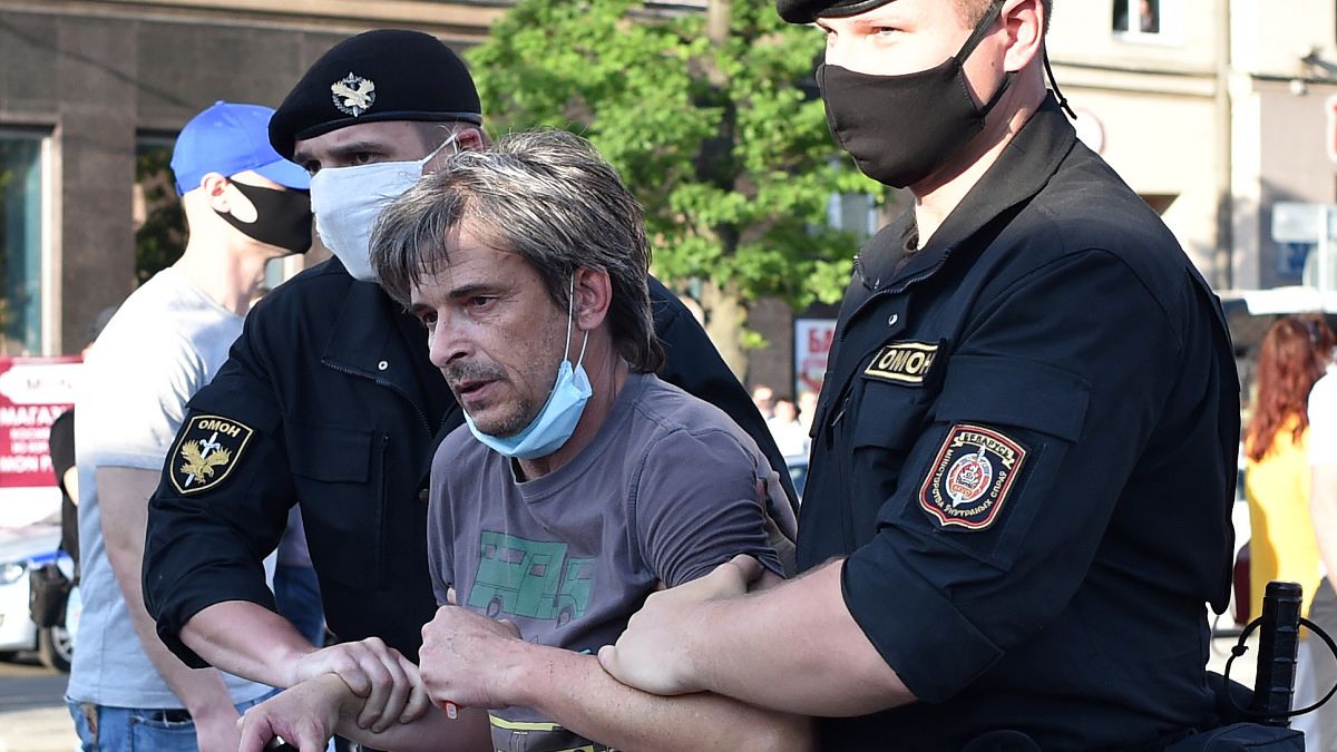Belarus' riot police detain a protester in Minsk on June 19, 2020