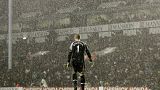 Tottenham Hotspur's goalkeeper Paul Robinson stands alone in the pouring rain during a Premier League match against Liverpool in 2006.