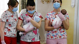 Nurses hold babies